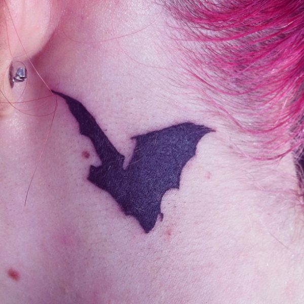 Adorable Black Bat Tattoo On Neck