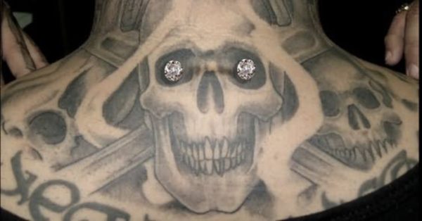 Adorable Skull Tattoo On Neck