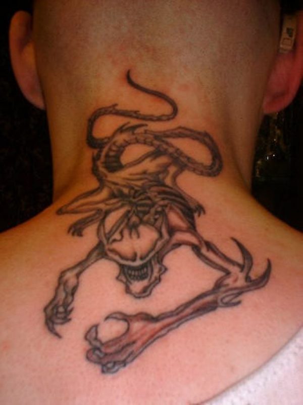 Alien Skull Tattoo On Back Neck