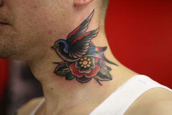 Amazing Flying Bird Tattoo On Neck