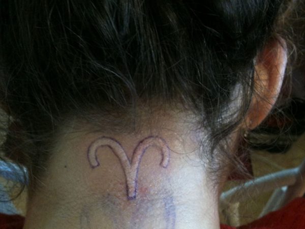 Aries White Tattoo On Neck