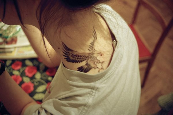 Attractive Black Eagle Tattoo On Neck