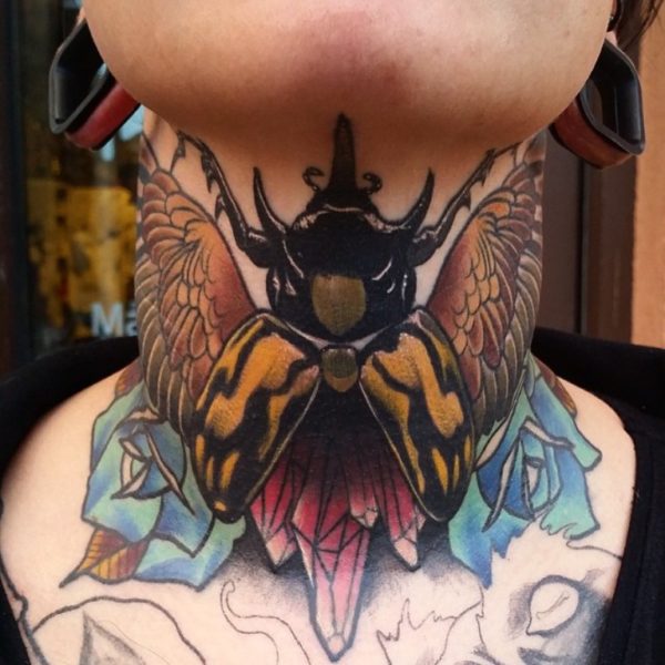 Big Bug Tattoo On Neck