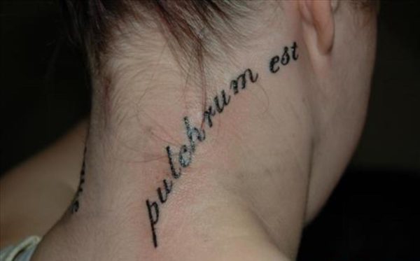 Black And Grey Lettering Tattoo On Neck