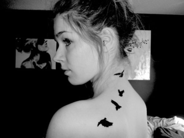 Black And White Birds Tattoo On Neck