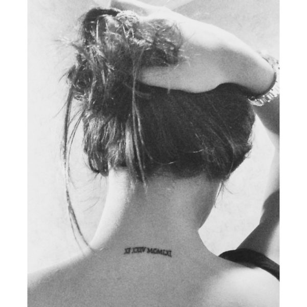 Black And White Roman Numeral Tattoo On Neck Back