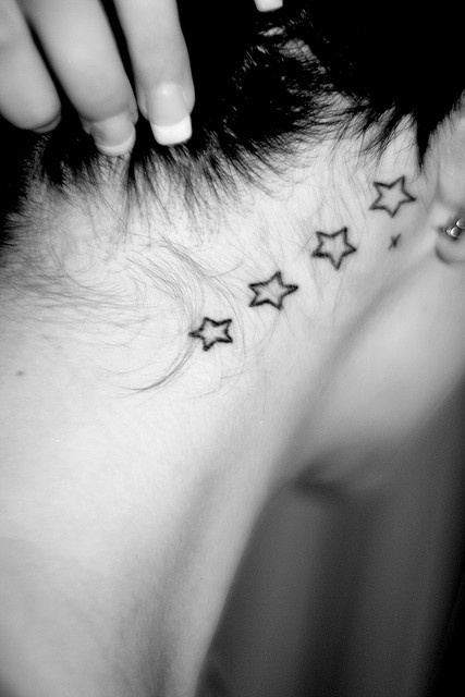 Black And White Stars Tattoo On Neck