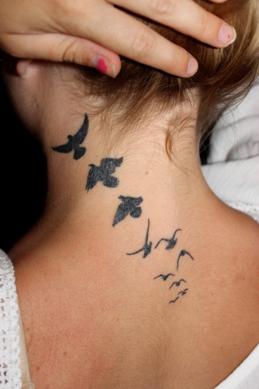Black Bird Tattoo On Neck 