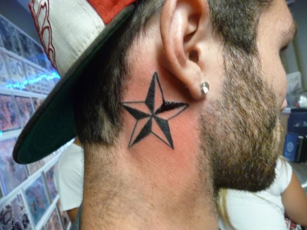 Black Star Tattoo On Neck 
