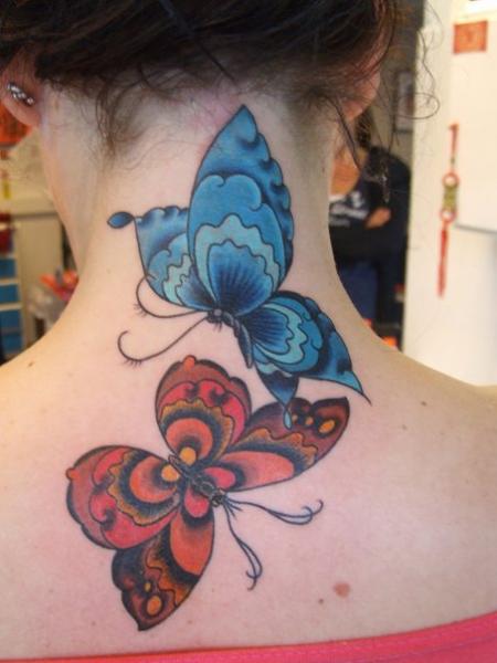 Blue And Red Tattoo On Neck