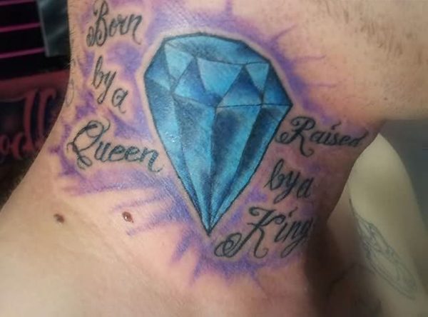 Born By A Queen Tattoo On Neck
