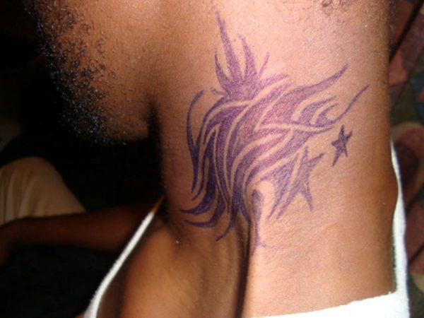 Colorful Tribal Tattoo On Neck Side