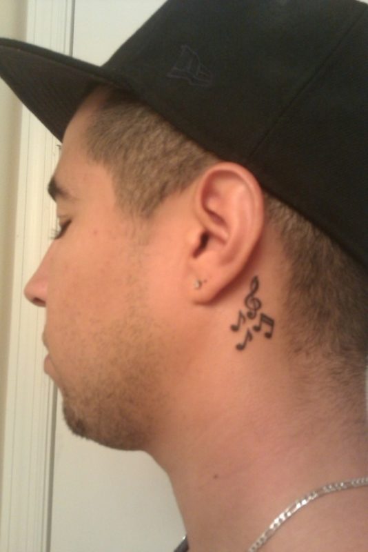 Cute Small Music Note Tattoo On Neck