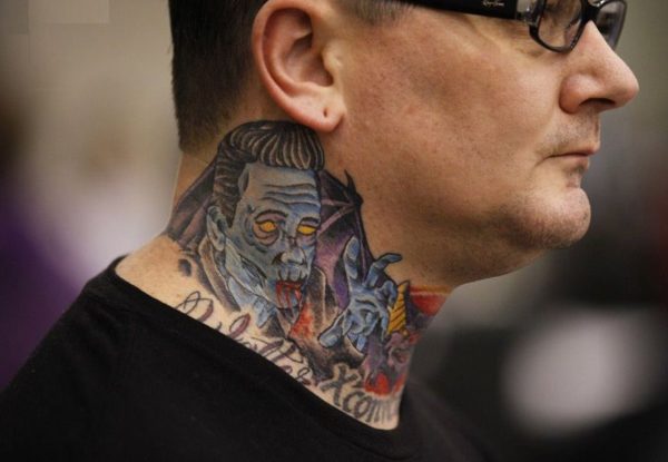 Devil Face Tattoo On Neck