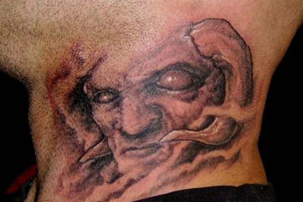 Evil Face Tattoo Design On Neck