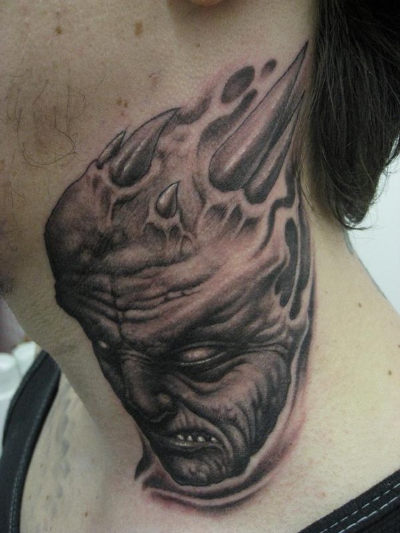 Evil Face Tattoo On Neck