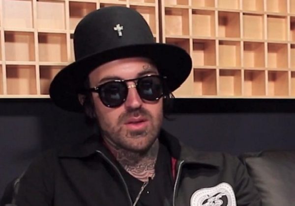 Feather Design Tattoo On Yelawolf Neck