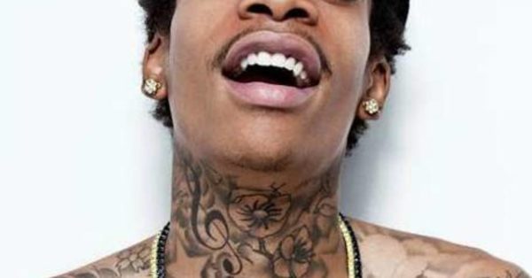 Flowers Design Tatto On Wiz Khalifa Neck