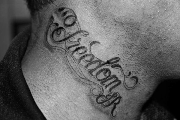 Freedom Lettering Neck Tattoo