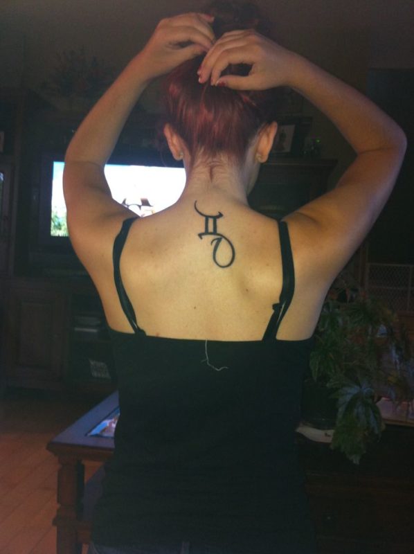 Gemini Design Tattoo On Back Neck
