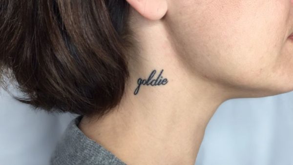 Goldie Word Tattoo On Neck