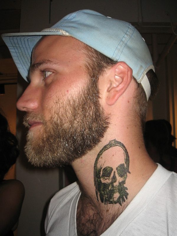 Grey Skull Tattoo On Neck