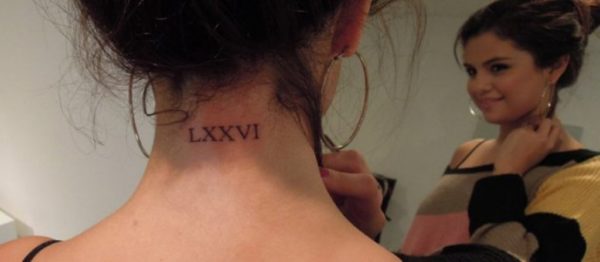 Impressive Roman Word Tattoo On Neck