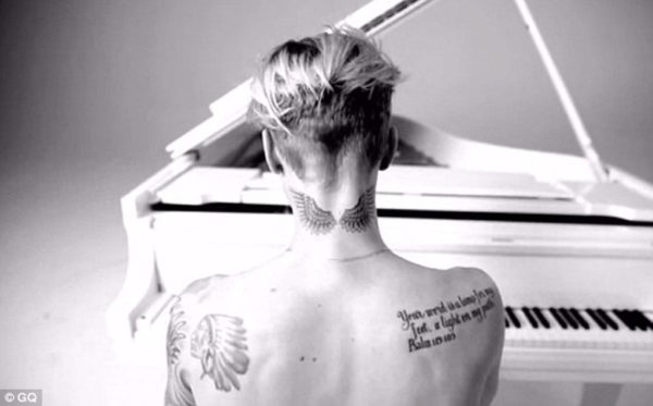 Justin Bieber Wings Tattoo On Neck 