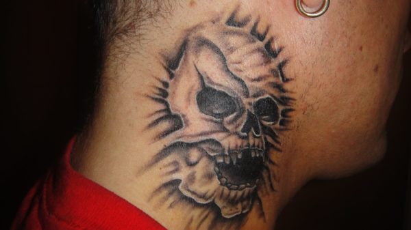 Laughing Skull Neck Tattoo