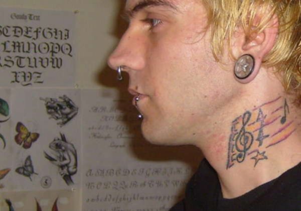 Musical Note Tattoo On Neck