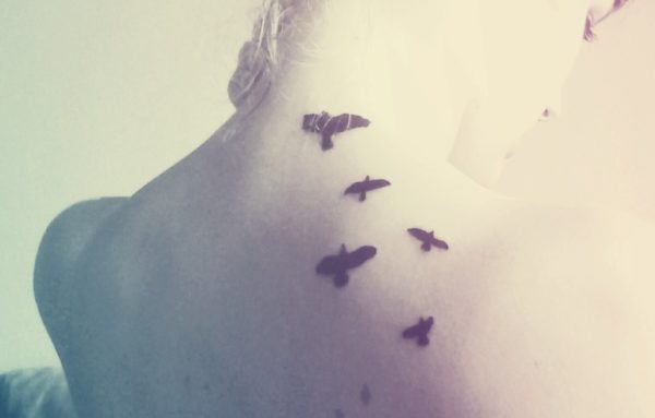 Nice Flying Birds Tattoo On Neck