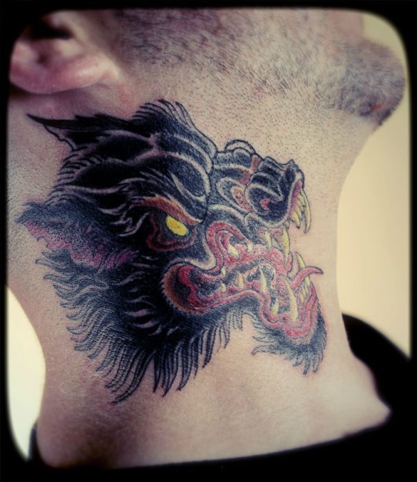 Red And Black Wolf Tattoo On Neck