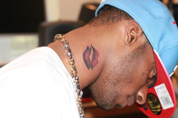 Red Kiss Mark tattoo On Neck