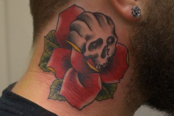 Red Rose And Skull Tattoo On Neck