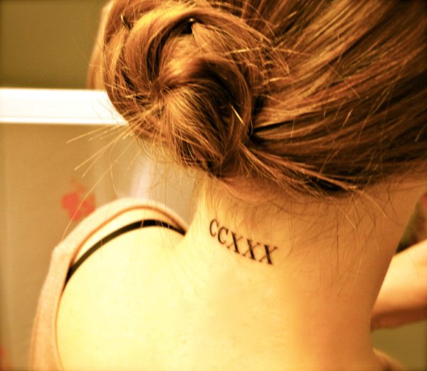 Roman Letter Tattoo On Neck