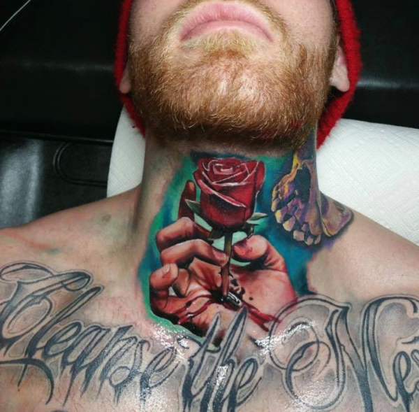 Rose And Hand Ripped Skin Tattoo