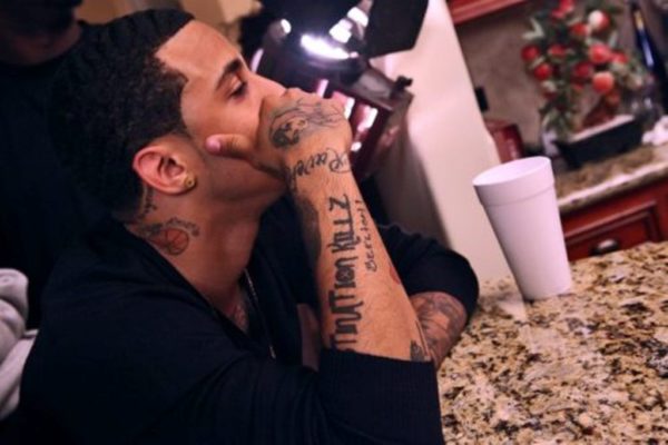 Small Kirko Bangz Tattoo On Neck