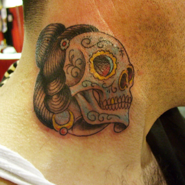 Small Skull Neck Tattoo