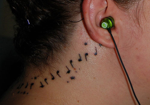 Stunning Musical Note Neck Tattoo Behind Ear