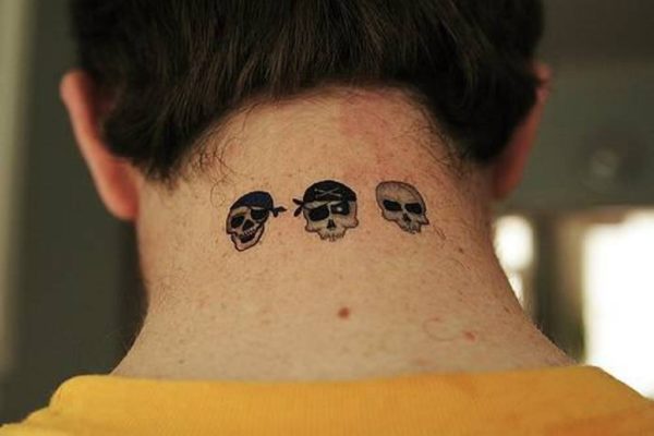 Three Small Black Skull Tattoo On Neck