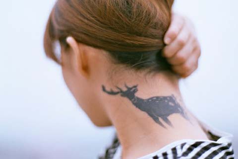 Tribal Deer Tattoo On Neck