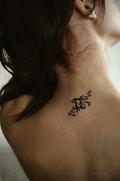 Vine Tattoo With Symbol