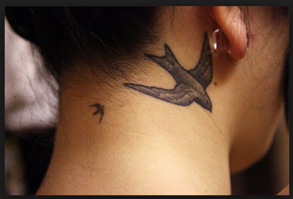 Wonderful Flying Bird Tattoo On Neck