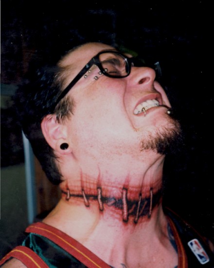 Wonderful Ripped Skin Tattoo On Neck