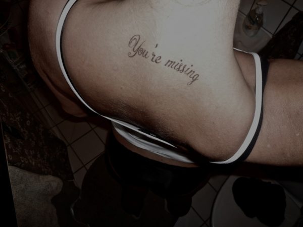 You Are Missing Wording Tattoo On Neck