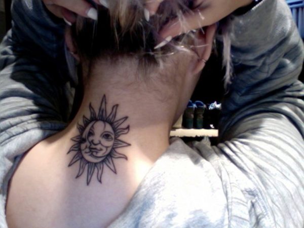 Big Sun Face Tattoo On Neck Back